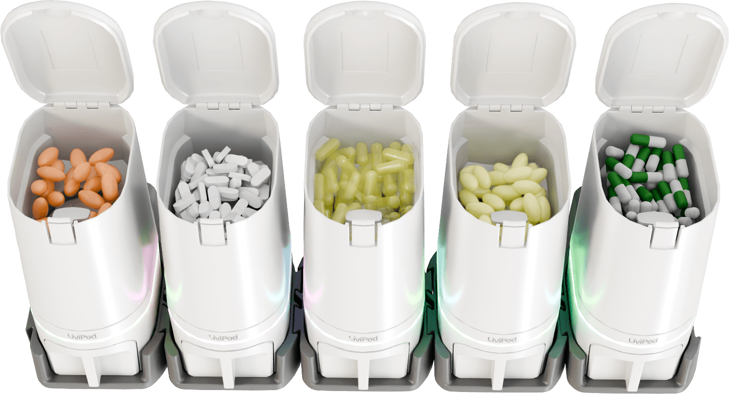 Five LiviPod dispenser pods, lids open, filled with medication, status rings lit at the base.